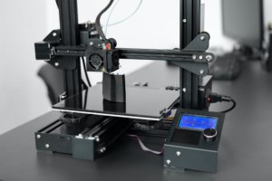 Electronic three dimensional plastic 3D printer during work in laboratory
