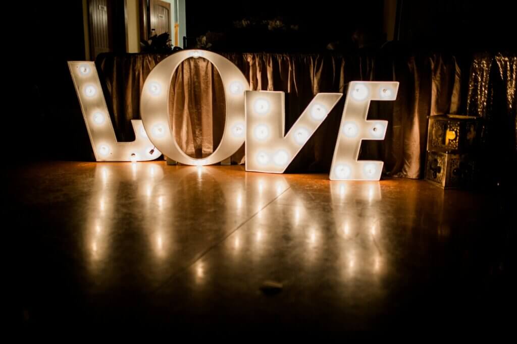 "Love" sign lit up at Wedding Reception.